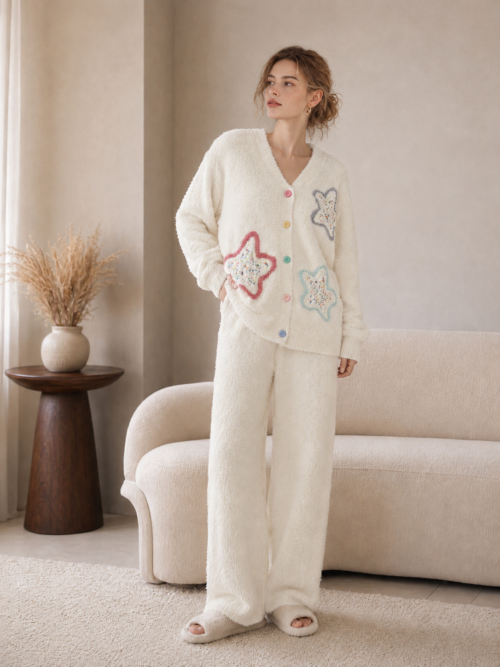 Cream white chenille loungewear set, V-neck button-front cardigan with colorful star applique and rainbow buttons, matching wide-leg pants with side pockets, soft fluffy knit 2-piece pajama set