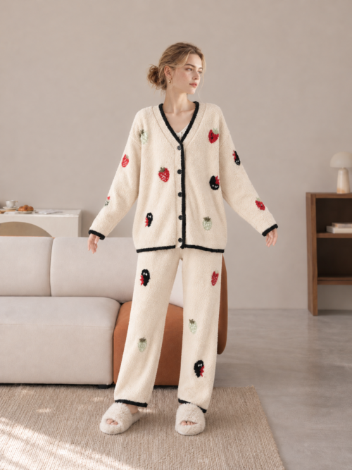 Half Fleece Pajama Detail View: V-Neckline, Button Closure, Strawberry Jacquard, Black Contrast Cuffs, Soft Fleece Fabric Texture