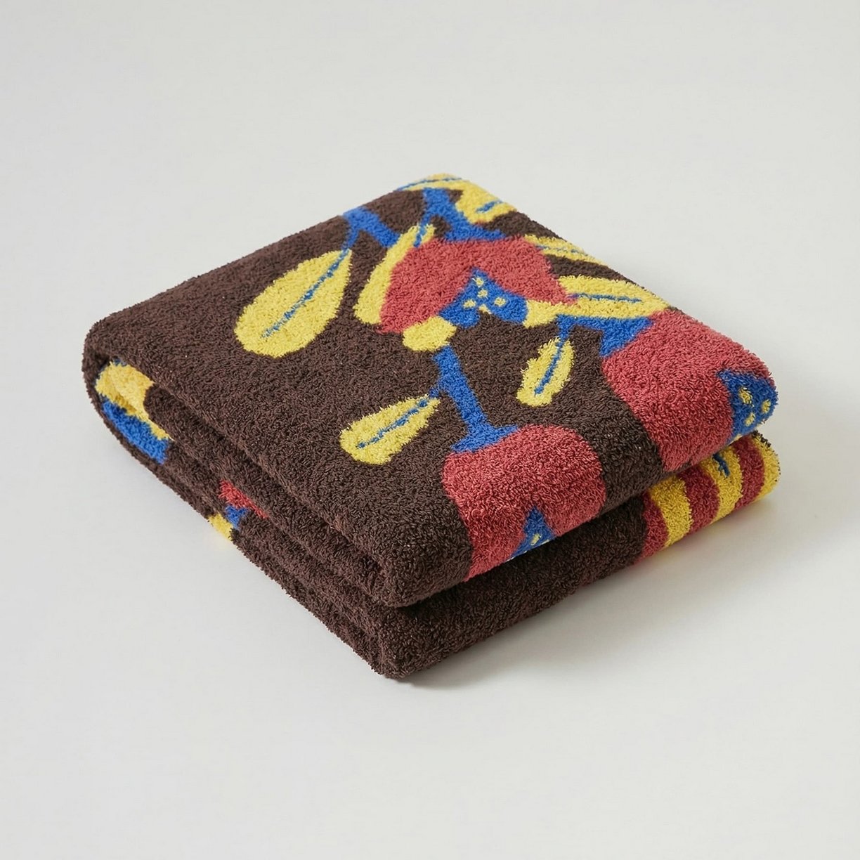 Folded Brown Half Fleece Knitted Throw Blanket with Floral Vase Pattern