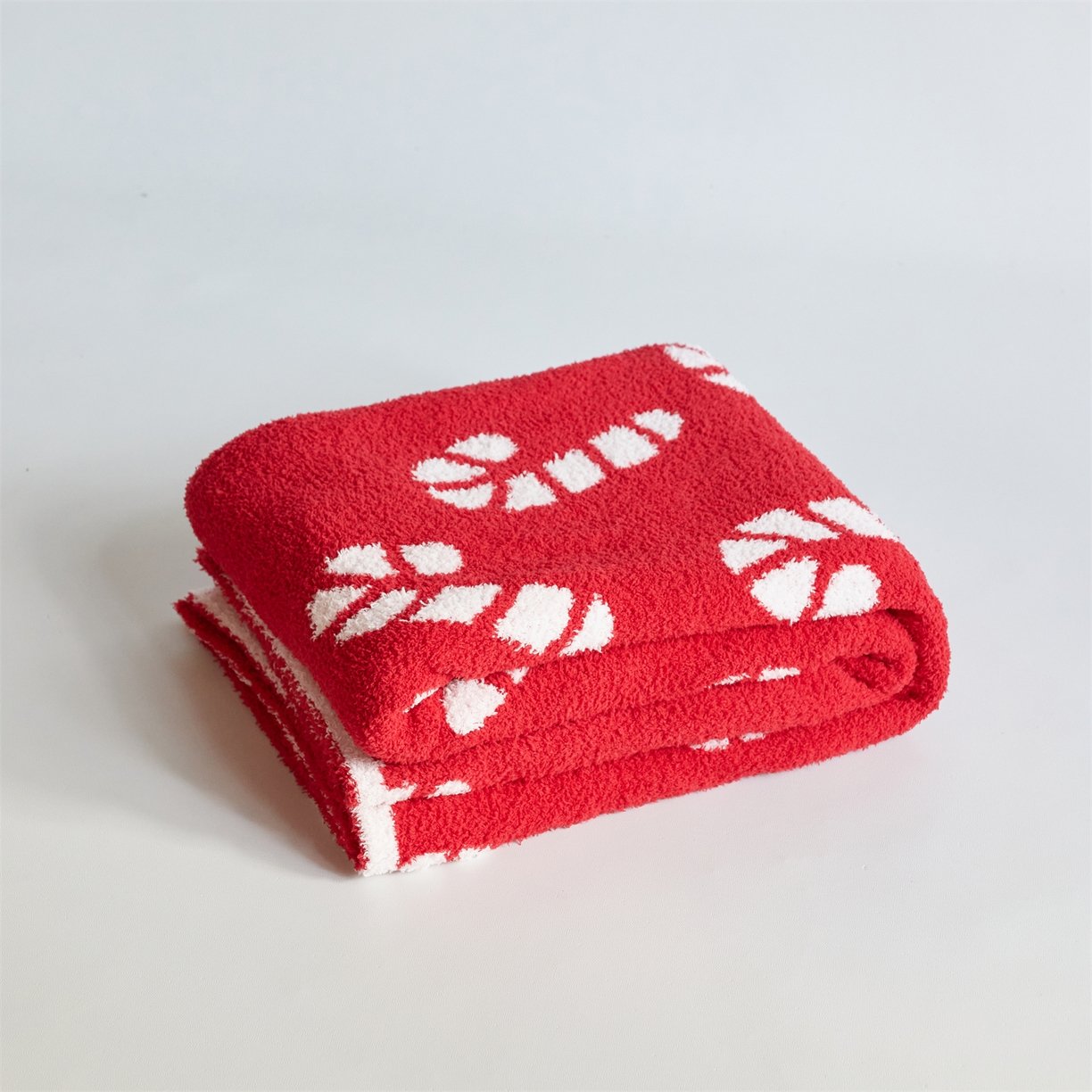 Folded Jacquard Half Fleece Throw Blanket, Red Base with White Christmas Candy Cane Pattern