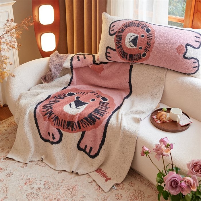 Jacquard Knitted Half Fleece Throw Blanket with Matching Long Pillow, Oatmeal Base with Pink Cartoon Lion Pattern, Draped View