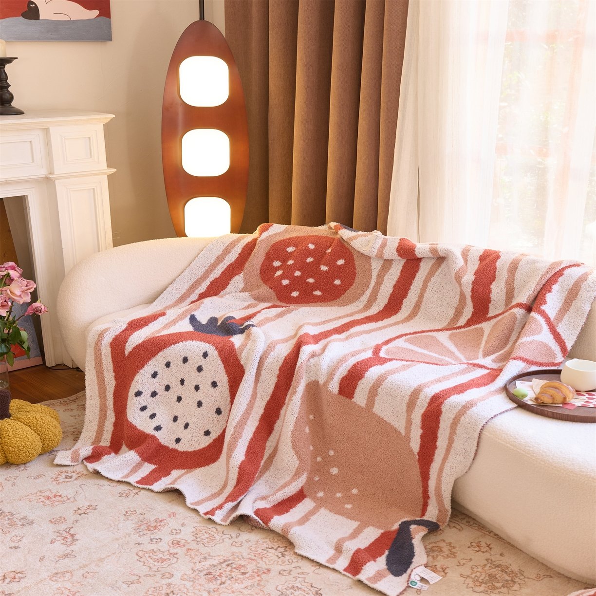 Jacquard Knitted Half Fleece Throw Blanket, Off-white Base with Red Stripe & Fruit Pattern, Full Sofa Draped View