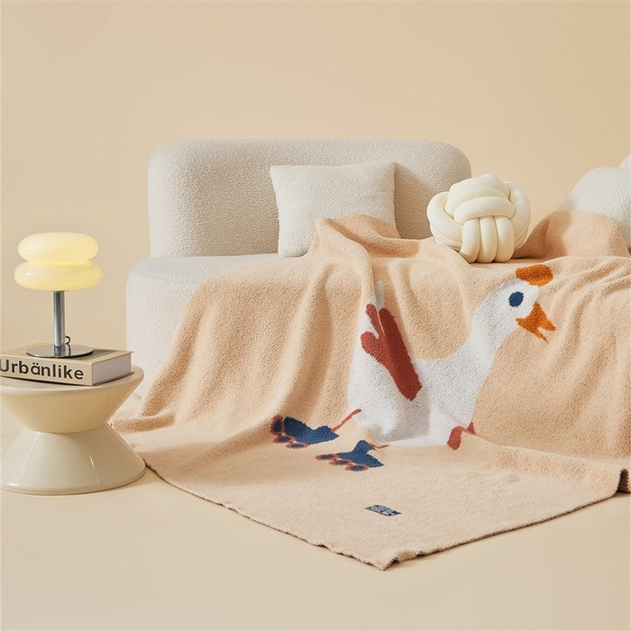 Apricot Half Fleece Knitted Throw Blanket with Roller Skating Goose Pattern, Draped View