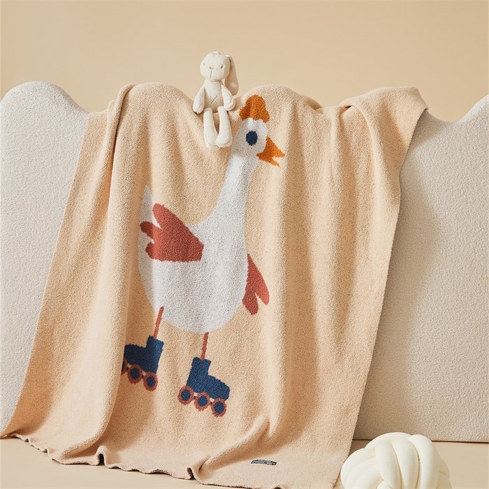 Apricot Half Fleece Knitted Throw Blanket with Roller Skating Goose Pattern, Flat View on Bed