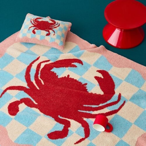 Blue & White Checkered Half Fleece Knitted Throw Blanket with Red Crab Pattern and Pink Wavy Border, Draped View