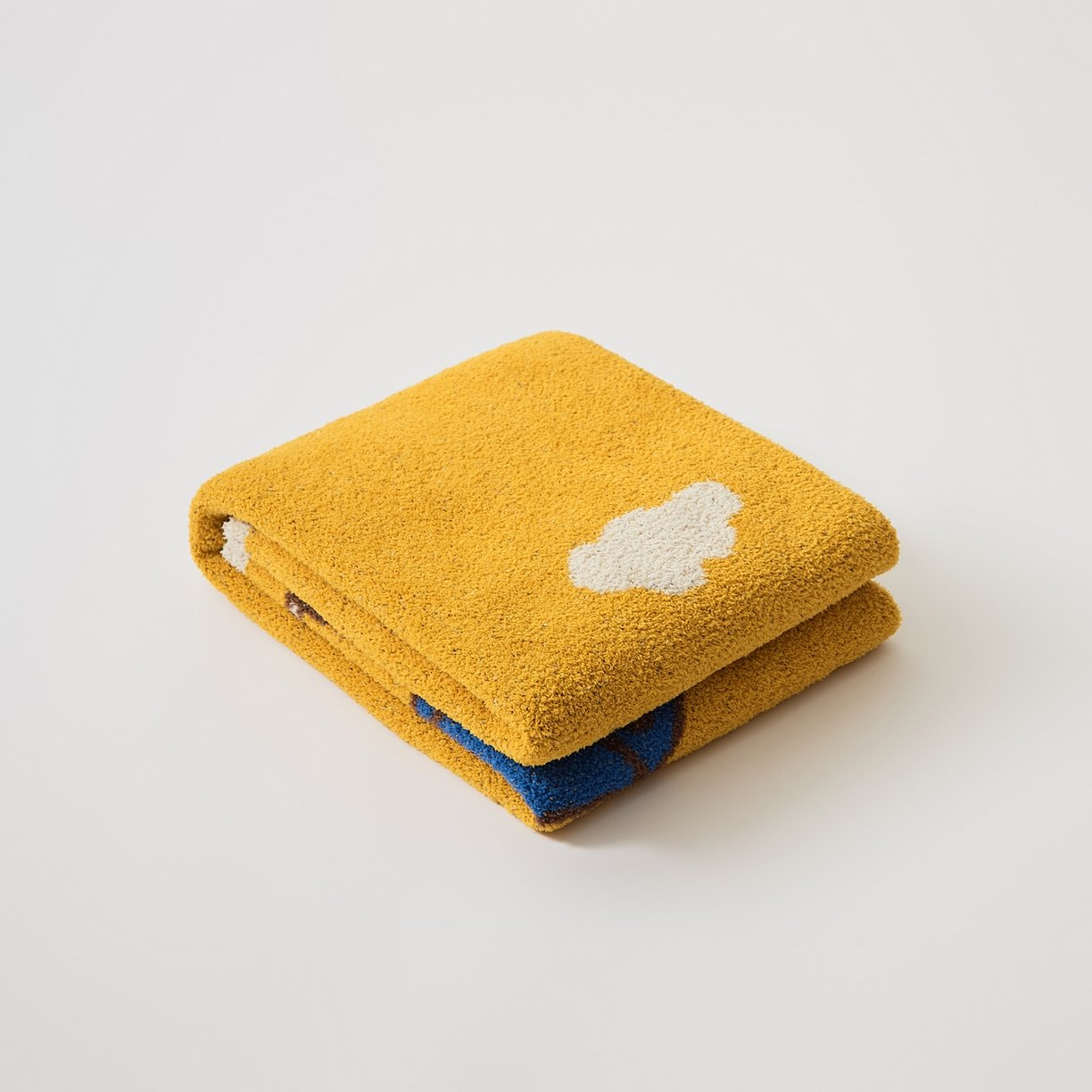 Folded Mustard Yellow Half Fleece Knitted Throw Blanket with Cloud Pattern Detail