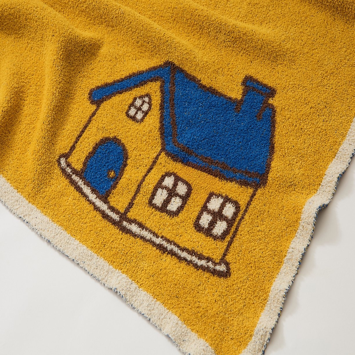 Mustard Yellow Half Fleece Knitted Throw Blanket House Pattern Detail Close-up