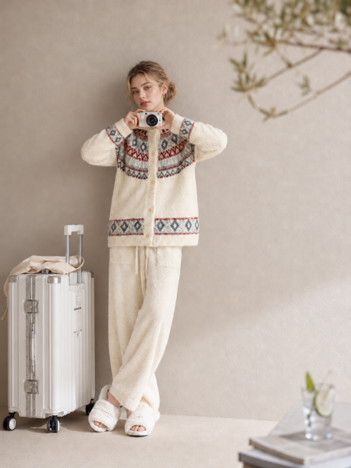 Cream plush fleece pajama set with burgundy and blue-gray diamond motifs, a ribbed-trim button-front cardigan and solid cream drawstring pants.