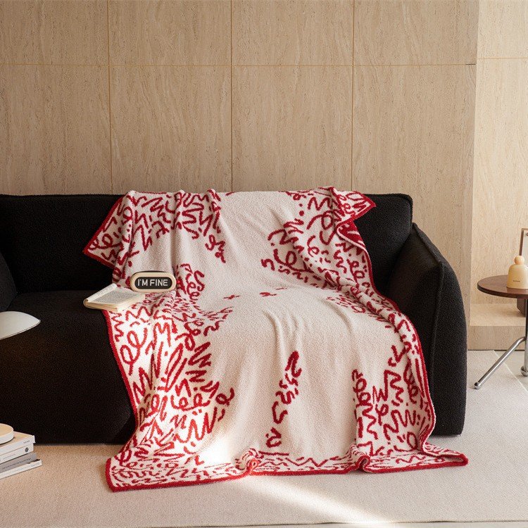 Jacquard Knitted Half Fleece Throw Blanket, Off-white Base with Red Abstract Graffiti Pattern, Draped View