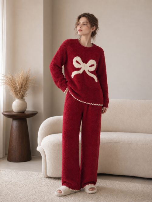 Woman wearing a burgundy bow half fleece pajama set with cream scalloped trim, full-body front view