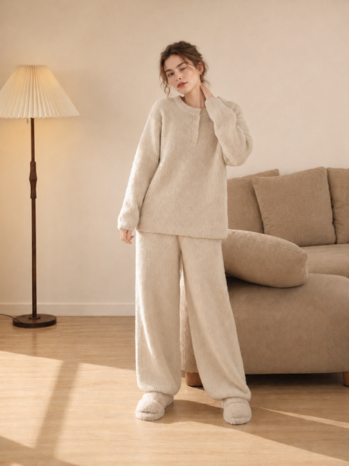 Woman wearing a beige Henley half fleece pajama set with matching relaxed pants, full-body front view